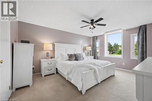 Recessed lighting, ceiling fan with light fixture, multiple windows, and light-colored carpeting - 67 Apple Tree Drive, Kitchener, ON 