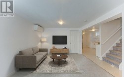 Basement (unit 2) living room AI staged - 