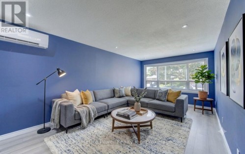 Main floor (unit 1) living room AI staged - 136 Dunsmere Drive, Kitchener, ON 