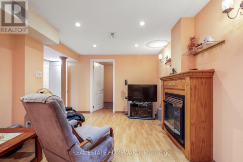 Rec room withTV and fireplace - 6399 Colebrook Crescent, Mississauga, ON 
