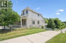 Brick and siding exterior with a covered porch featuring white columns - 426 Hidden Creek Drive, Kitchener, ON 