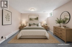 Recessed window, textured ceiling, flush mount ceiling light, wall-mounted baseboard heating, carpeted flooring - 