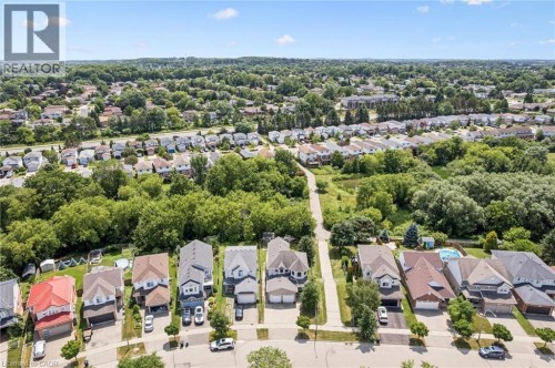 Residential neighborhood with mature trees, green spaces, and a variety of architectural styles - 426 Hidden Creek Drive, Kitchener, ON 