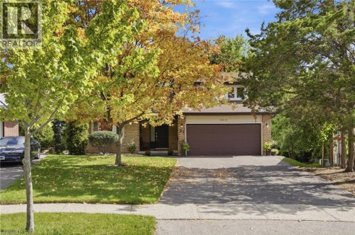 Brick exterior with a two-car garage - 22 Ripley Crescent, Kitchener, ON 