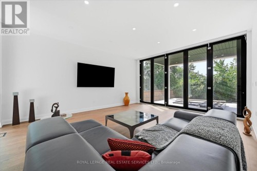 Family Room Offers Floor-To-Ceiling Bi-Fold Doors - 36 Windemere Road, Hamilton, ON 