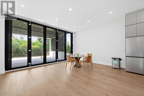 Floor-To-Ceiling Bi-Fold Doors in Dining Room - 36 Windemere Road, Hamilton, ON 