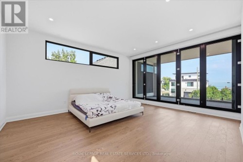 Floor-To-Ceiling Bi-Fold Doors in Primary Bedroom - 36 Windemere Road, Hamilton, ON 