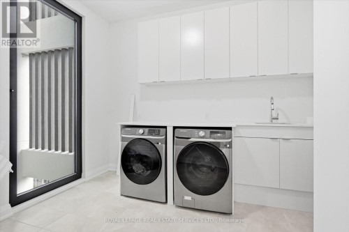 Bright Laundry Room with a Floor-To-Ceiling Window - 36 Windemere Road, Hamilton, ON 