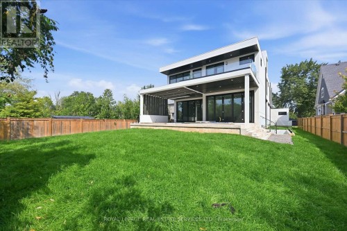 Expansive Backyard with a Covered Concrete Patio - 36 Windemere Road, Hamilton, ON 