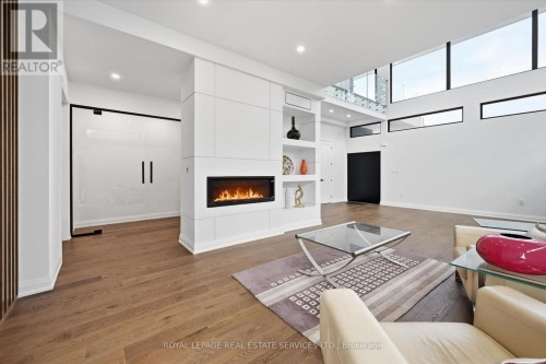 Living Room Features a Linear Gas Fireplace - 36 Windemere Road, Hamilton, ON 