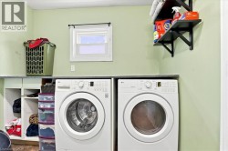 Built-in countertop with under-counter storage, window with dark rod, and wall-mounted shelving - 