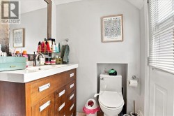Modern vanity with a integrated rectangular sink and wood-finish cabinetry - 