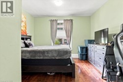 Hardwood-style flooring and a window with natural light - 