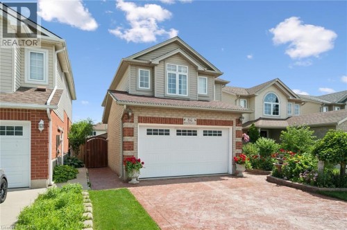 Brick and siding exterior with a two-car garage - 86 Bridlewreath Street, Kitchener, ON 