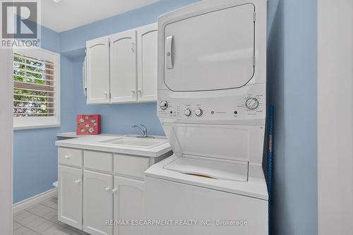Second floor laundry with a large linen closet - 112 Fairwood Place W, Burlington, ON 