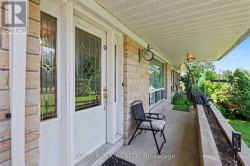 Covered front porch with a 2-gate dog run - 