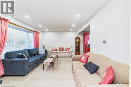 Recessed ceiling lighting, light wood-finish flooring, and a large picture window - 41 Tuerr Drive, Kitchener, ON 