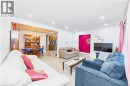 Recessed lighting throughout, wood-finish flooring, and an open layout to the dining area - 41 Tuerr Drive, Kitchener, ON 