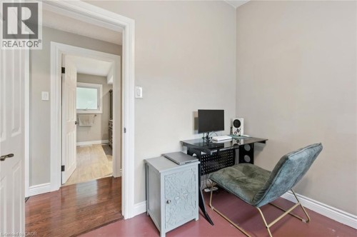 Hardwood-finish flooring, white trim, and light-colored wall paint - 100 Forest Hill Drive, Kitchener, ON 