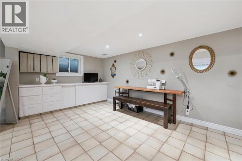 Recessed lighting, tile flooring, built-in cabinetry, and a window - 100 Forest Hill Drive, Kitchener, ON 