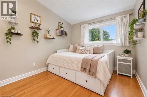 Hardwood flooring, crisp white trim, and a window with natural light - 100 Forest Hill Drive, Kitchener, ON 