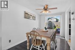 Laminate flooring, sliding glass door,  ceiling fan, and backyard access - 