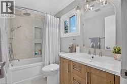 Wood-finish vanity with a white countertop and undermount sink - 