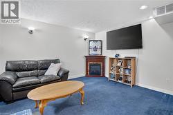wall sconces,  blue carpet flooring, and Gray painted walls - 