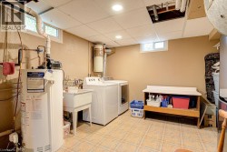 Utility room with a utility sink, and recessed lighting - 