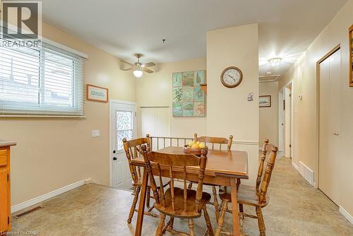 Warm-toned walls with a large window and ceiling fan - 210 Shelley Drive, Kitchener, ON 