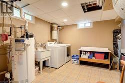 Utility room with a utility sink, and recessed lighting - 