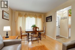 Light wood-finish flooring throughout, complemented by neutral wall tones - 