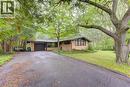 Ranch-style exterior with a paved driveway, integrated garage, and a expansive front lawn - 80 Chapel Hill Drive, Kitchener, ON 
