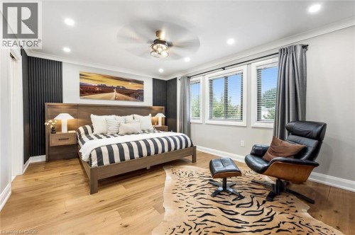 Recessed lighting, wood-finish flooring, ceiling fan, and multiple windows with blinds - 1261 Stephenson Drive, Burlington, ON 