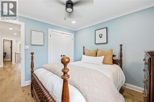 Crown molding, wood-finish flooring, and a ceiling fan with integrated lighting - 1261 Stephenson Drive, Burlington, ON 