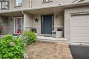 Brick exterior with stone accents, covered front entry, and attached garage - 1261 Stephenson Drive, Burlington, ON 