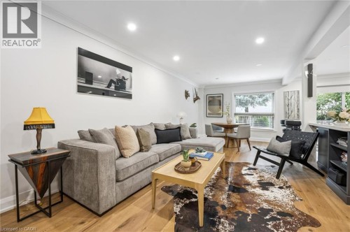 Recessed lighting, crown molding, wood-finish flooring, bay window, and built-in shelving - 1261 Stephenson Drive, Burlington, ON 