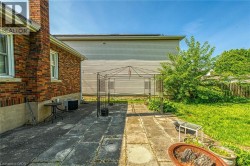 View of patio / terrace with central air condition unit and a gazebo - 