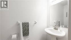 Half bath featuring a sink and toilet - 
