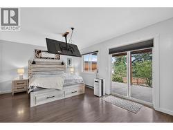 Primary bedroom with sliding glass doors - 