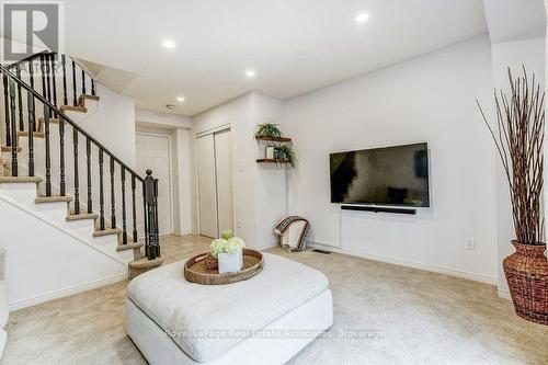 Family room with closet and garage access - 7222 Deanlee Court, Mississauga, ON 
