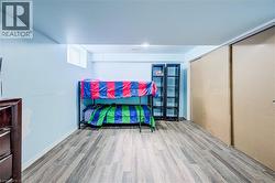 Recessed lighting, wood-finish flooring, and built-in closet with sliding doors - 
