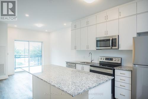 large island with ample seating space - 205 - 102 Grovewood Common, Oakville, ON 