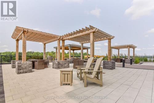 Complete with communal BBQs and sitting area - 306 - 150 Wellington Street E, Guelph (Downtown), ON 
