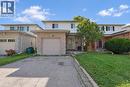 Two-story residential structure featuring a single-car garage, brick facade, and front lawn - 95 Resurrection Drive, Kitchener, ON 