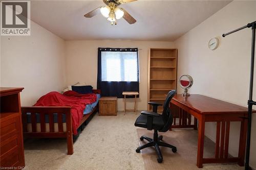Recessed window with blinds, overhead ceiling fan, and carpeted flooring - 95 Resurrection Drive, Kitchener, ON 