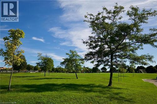 Expansive green space featuring mature trees and a manicured lawn - 95 Resurrection Drive, Kitchener, ON 