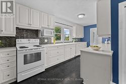 Overlooking the front yard...& so many cupboards! - 