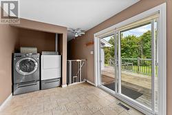 Mudroom with laundry off garage & access to deck - 