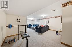 Carpeted flooring throughout, recessed lighting, and light-toned walls - 